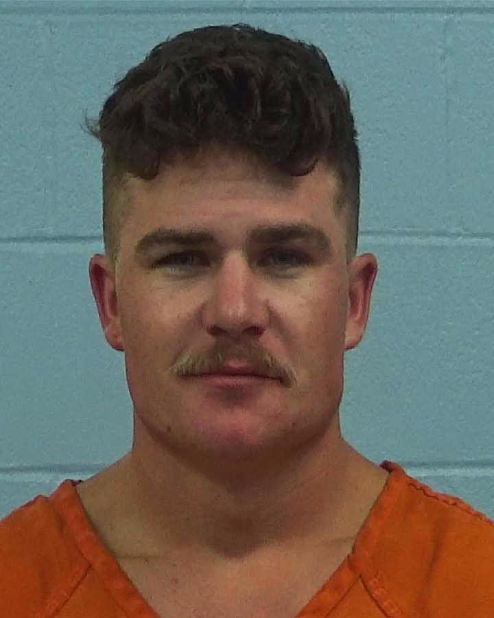 Frieda, Regan Wayne booking photo