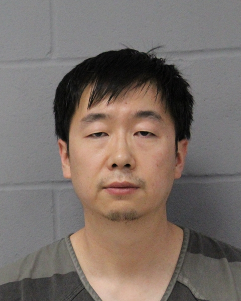 PING WANG arrested by APD
