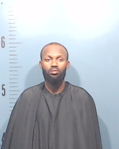 Mutabazi, Christian booking photo