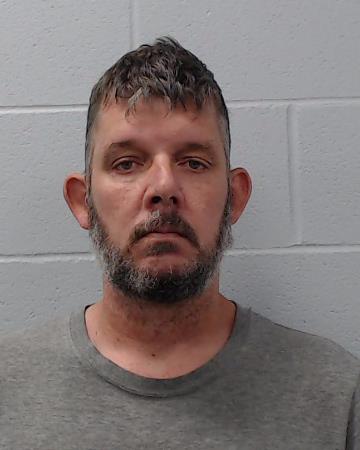 Holmes, Justin Shawn booking photo