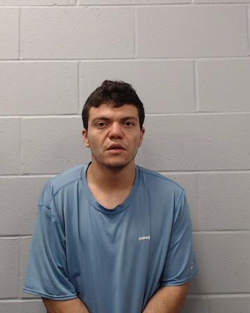 Flores, Justin James booking photo