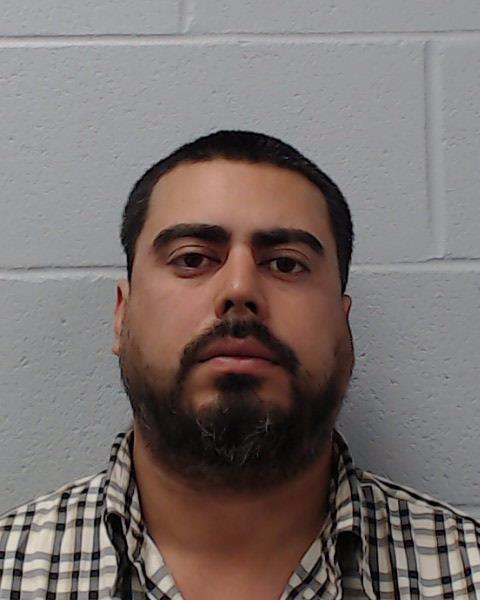 Olivares, Santos, Jr. booking photo