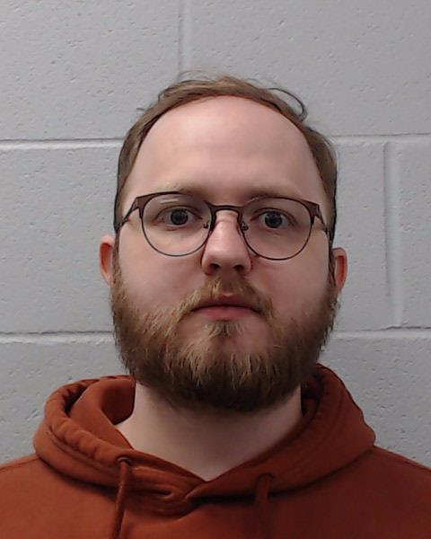 Calhoun, Travis Wilson booking photo