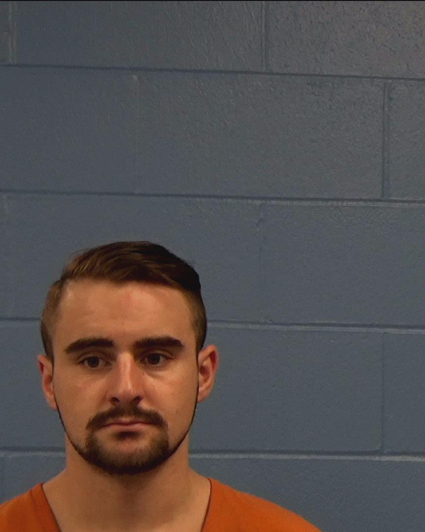 Toms, Travis Wilson booking photo