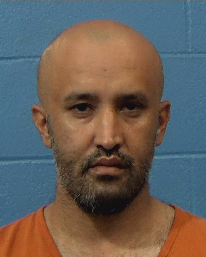 Behroz, Khalid Tom booking photo