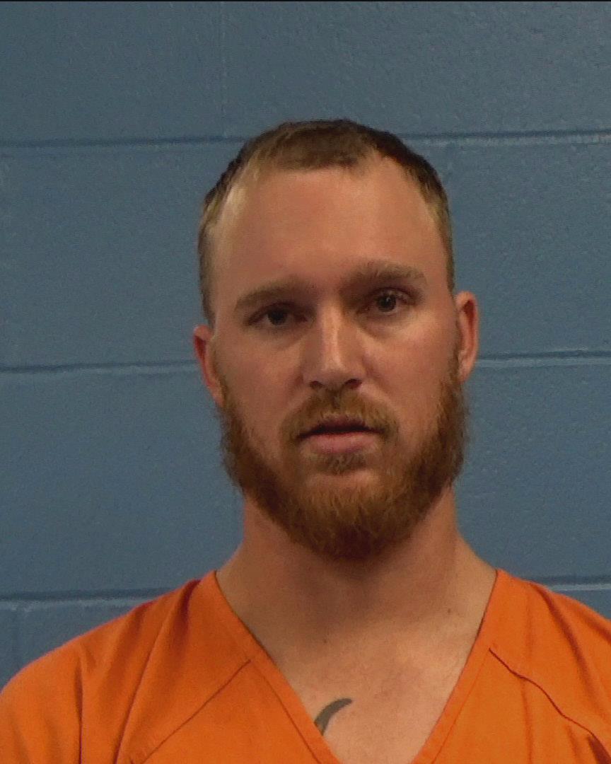 Tanner, Calib Thomas booking photo