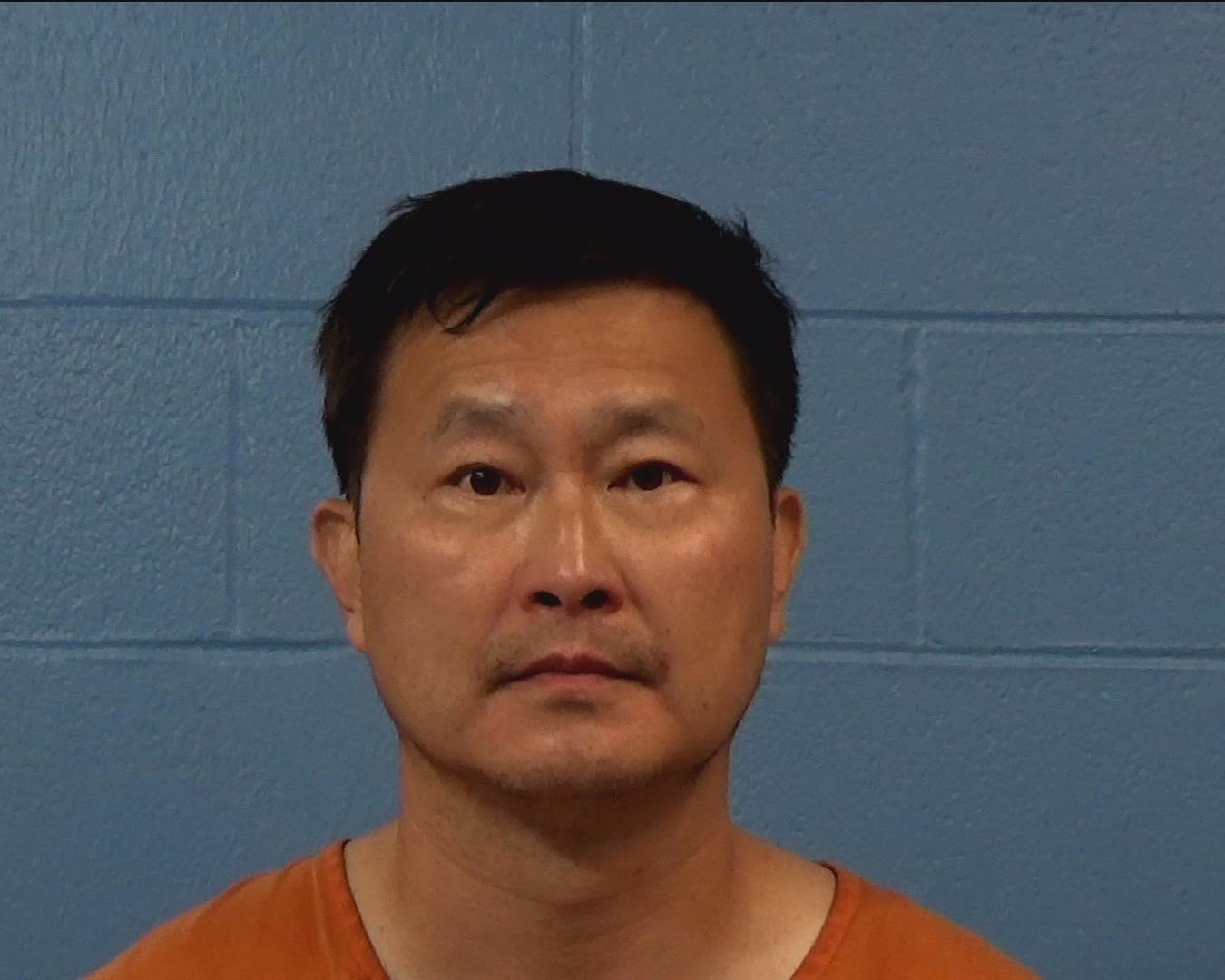 Kim Whitty, Suk Kon booking photo
