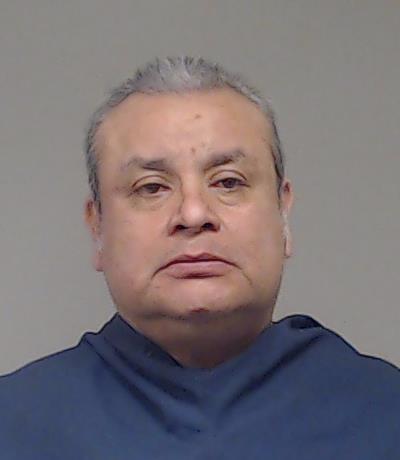 Gomez, Hebert booking photo