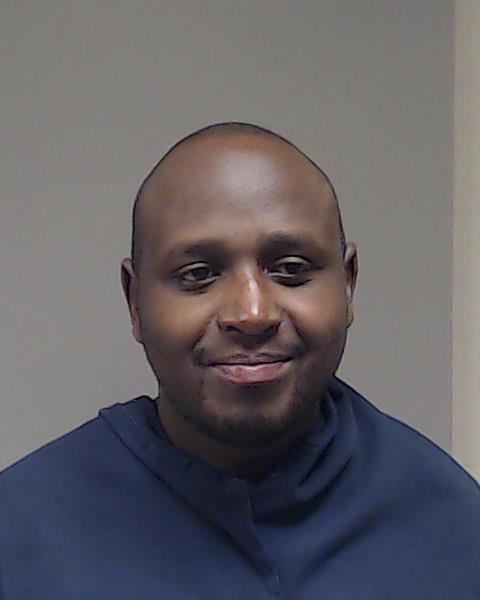 Muturi, John K booking photo