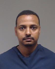 Mulugeta, Tomas Negash booking photo