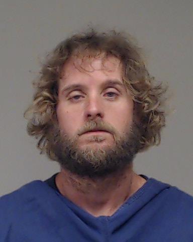 Riddles, Connard booking photo