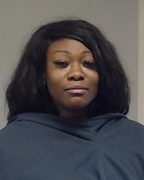 Asini, Marilynn Marcel booking photo