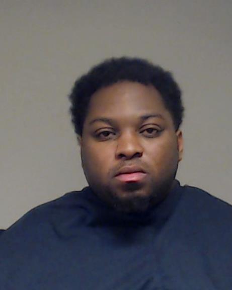 Akozar, Azuka Austin booking photo