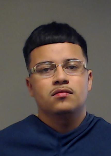 Carlos, Edgar booking photo