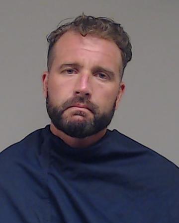 Tucker, Barrett Clark booking photo