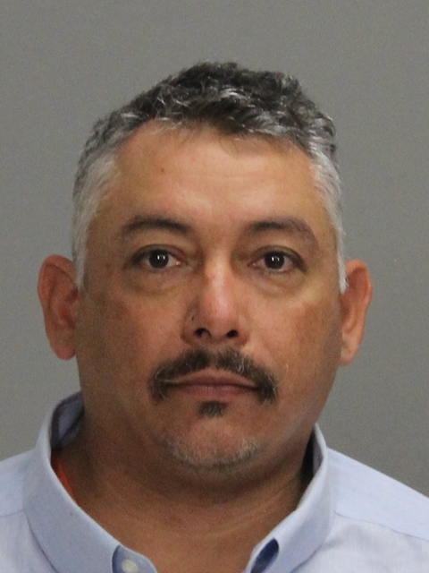 Mata, Enrickez booking photo