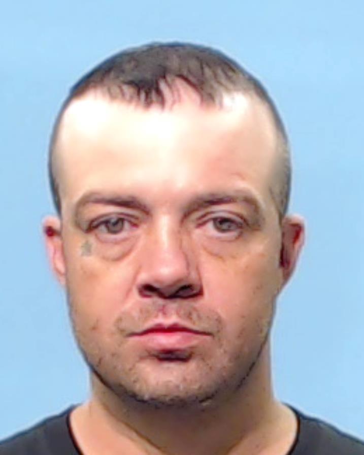 Neighbours, Carroll Wayne booking photo