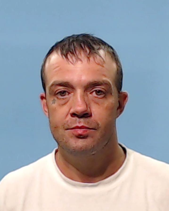 Neighbours, Carroll Wayne booking photo