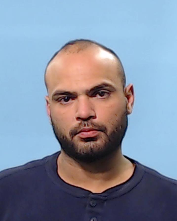 Zamora, Caine booking photo