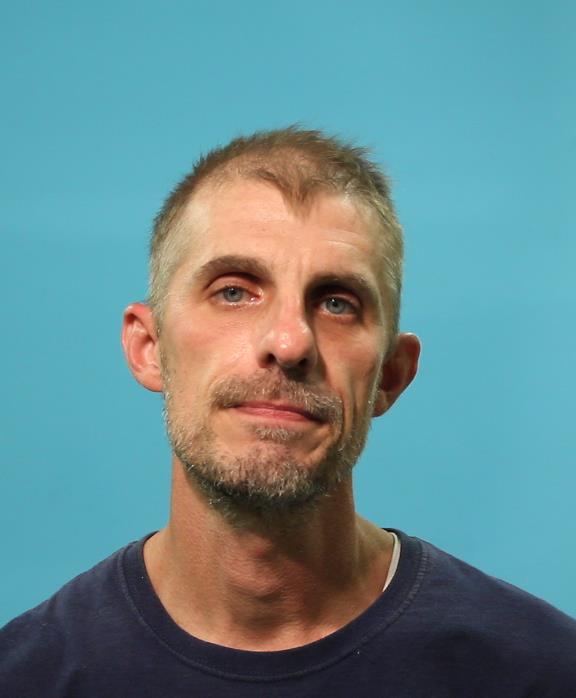 Moore, Tommy John booking photo