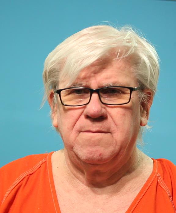 Suza, Bruce Wayne booking photo