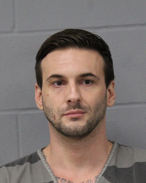 CARL MCMILLON arrested by APD